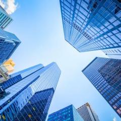 shutterstock_429089002 Up view in financial district, Manhattan, New York.jpg